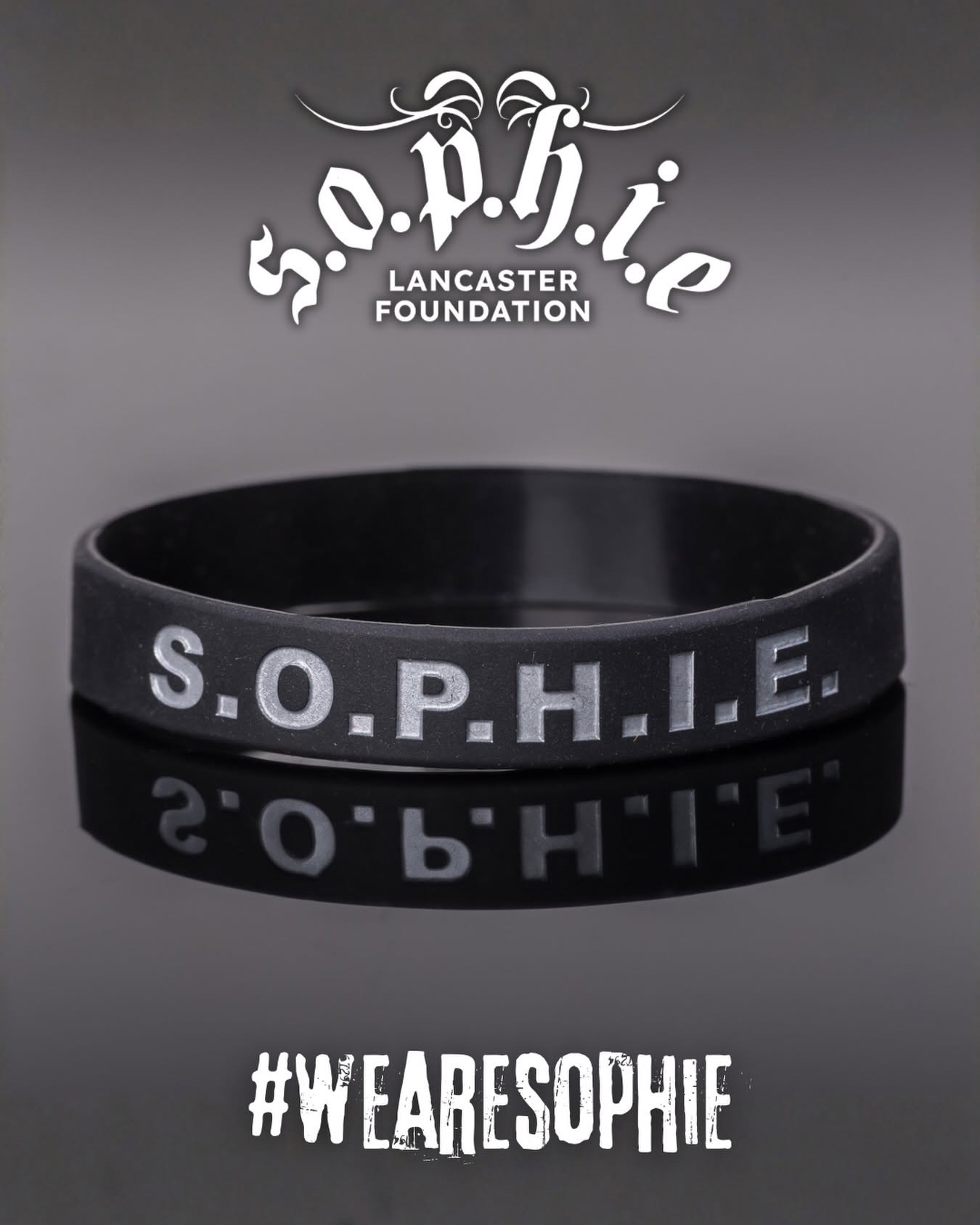 A black S.O.P.H.I.E. wristband